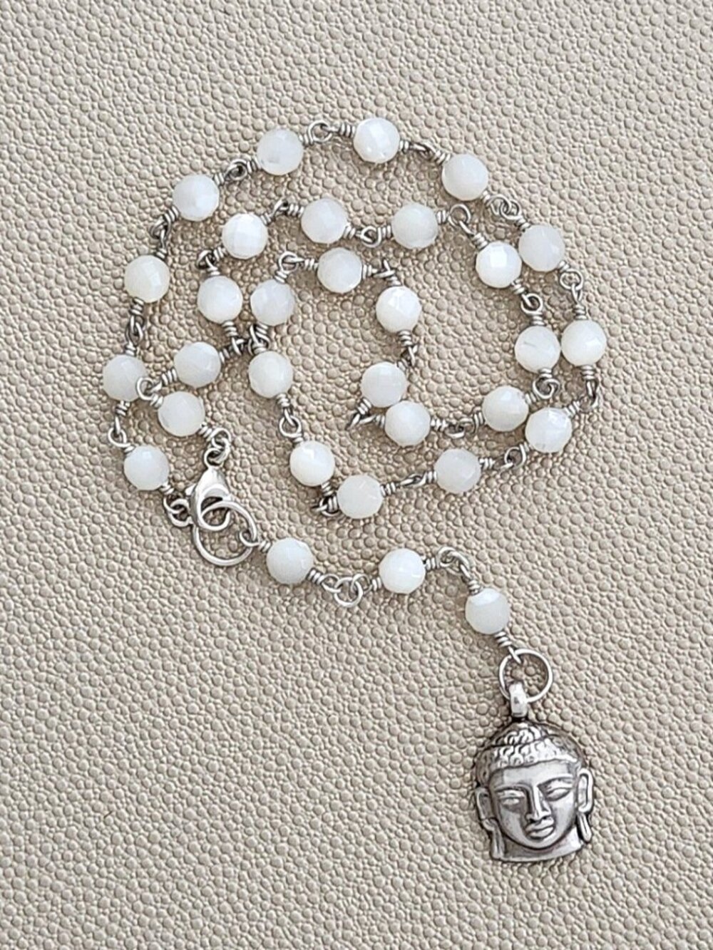 MOTHER OF PEARL NECKLACE WITH STERLING SILVER BUDDHA PENDANT